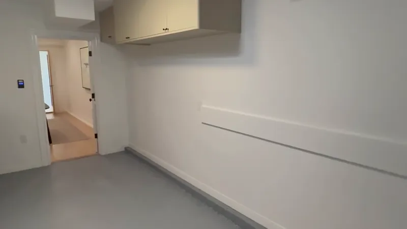 Finished corridor and casework in a completed commercial fit-out ready for handover