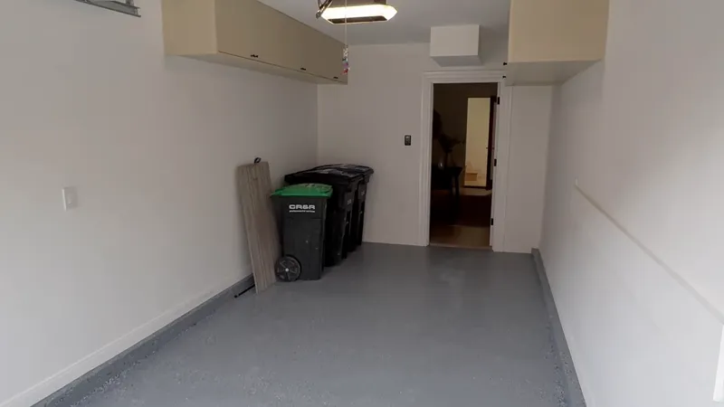 Walkthrough of a finished commercial interior with painted walls, upper casework and a sealed floor