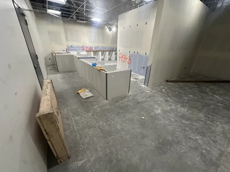 Service counter and low wall formed in drywall, corners beaded, waiting on the finish trades