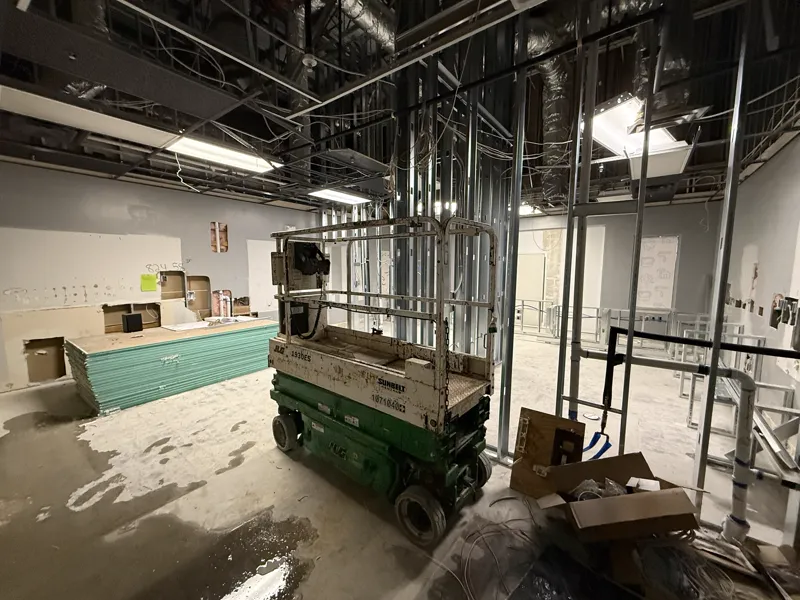 Metal stud partitions standing with electrical and mechanical services run through the open ceiling